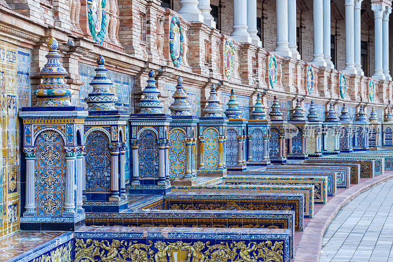 The beautiful decorated ornaments at Plaza de España during an colourful sunrise in the centre of Seville